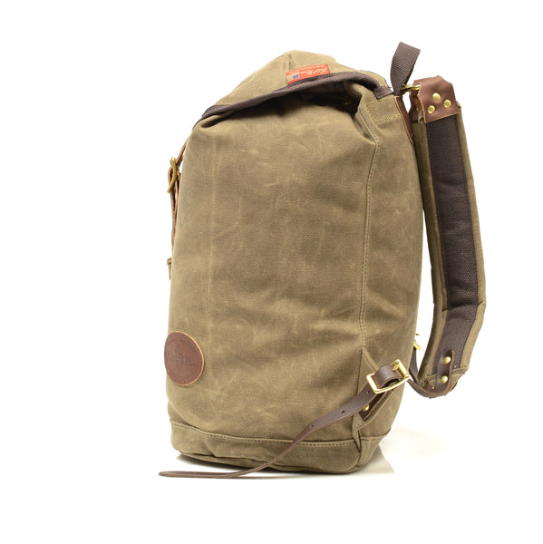 Side view of this large ruck sack that shows it can carry a large load handmade by Frost River Trading Co.
