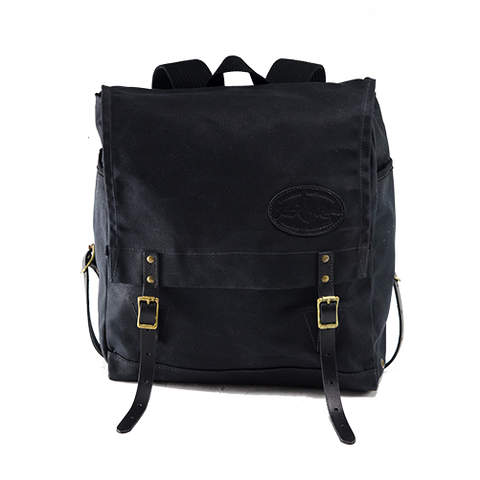 The heritage black version of the Sojourn Pack is made with waxed canvas, premium leather and high quality brass buckles.