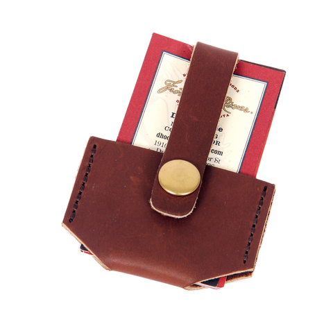 This small wallet is handcrafted out of our high-end leather and durable solid brass. With a small leather strap that goes over your cards and a solid brass snap to hold them in place.