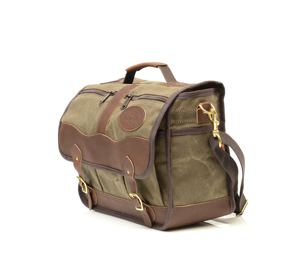 A premium leather strap on top and a strong webbed cotton shoulder strap reinforced by two solid brass attachment points makes transporting this bag easy.