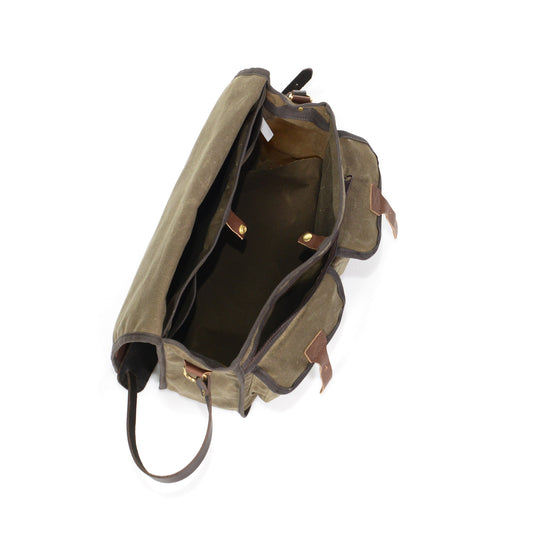 The interior has two slip sleeve pockets and a spacious main cavity. To secure your gear is a solid brass snap.
