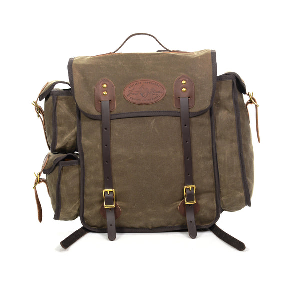 This olive green waxed canvas box style pack will get you through anything. With two premium leather straps on the front to secure your load and with two small pockets on one side and one long pocket on the other, there's plenty of space.