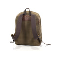 Back view of backpack with durable shoulder straps connections with high quality brass rivets and buckles and is adjustable with premium leather straps.