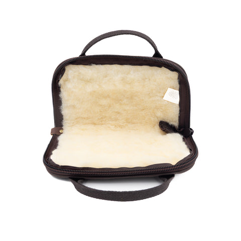 open waxed canvas pistol rug showing off sherpa lining