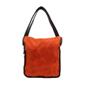Backside of a hunter orange messenger bag made from 10 ounce waxed canvas