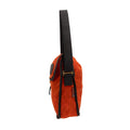 Side view of a hunter orange waxed canvas messenger bag