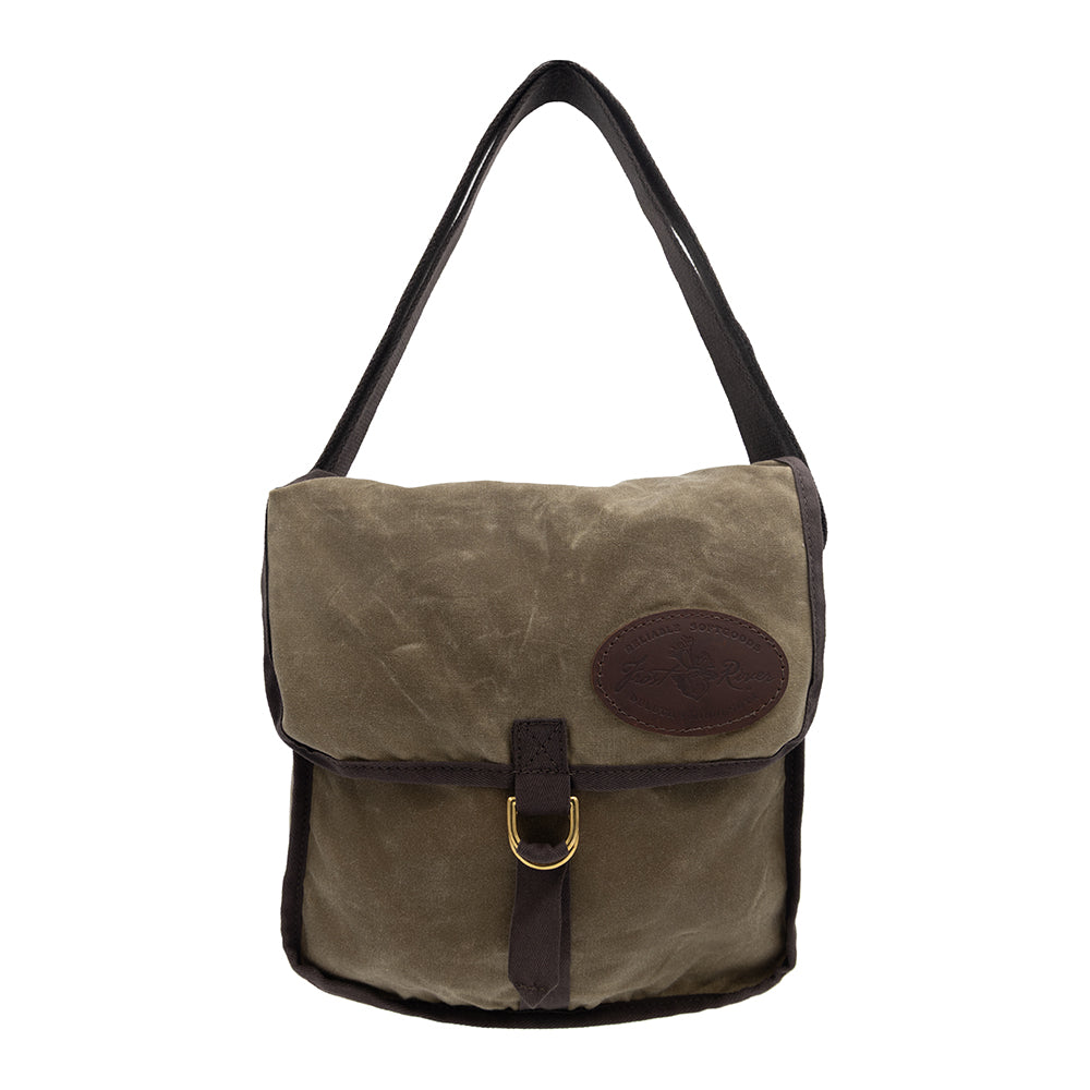 A messenger bag made from 10 ounce waxed canvas, cotton web, and solid brass
