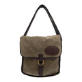A messenger bag made from 10 ounce waxed canvas, cotton web, and solid brass