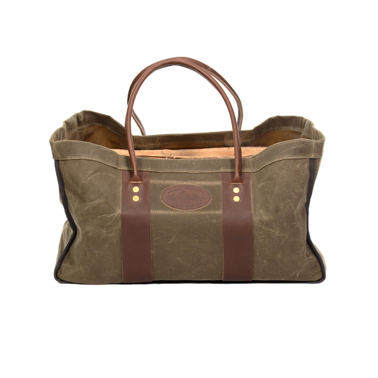 Waxed canvas and leather four sided log carrier bag. 