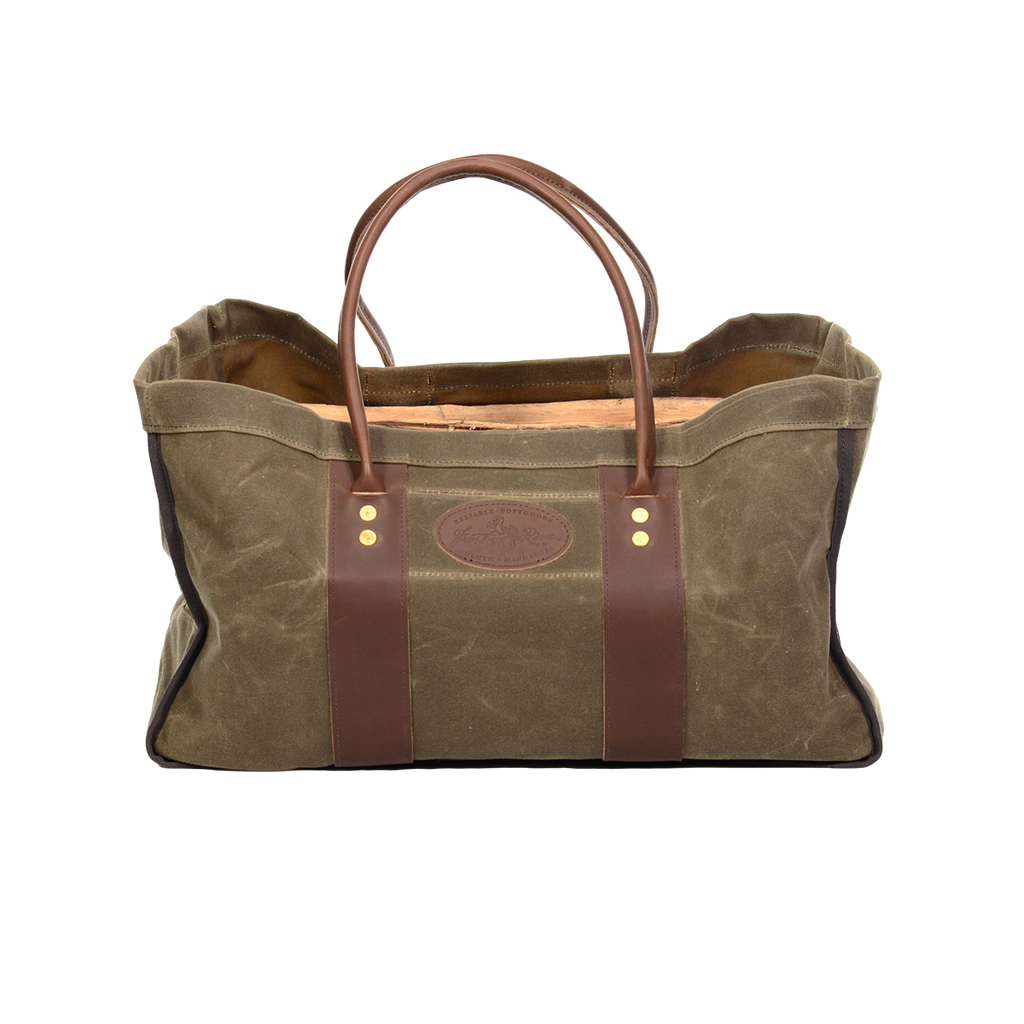 Waxed canvas and leather four sided log carrier bag. 