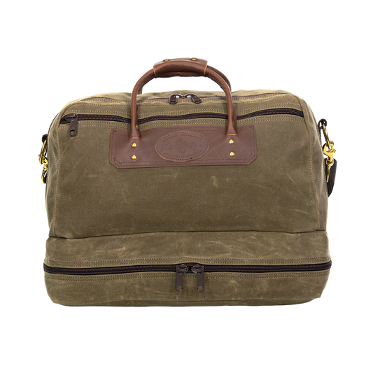 Waxed Canvas and leather duffel bag with a separate compartment for boots or dirty clothes. 