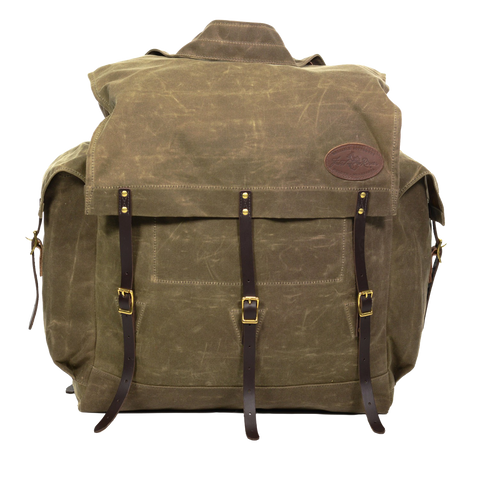 Traditional style waxed canvas canoe pack with two side pockets and a traditional style canoe pack. 