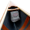 Frost River's Canoe Bow Bag strapped to the bow of a cedar strip canoe. 