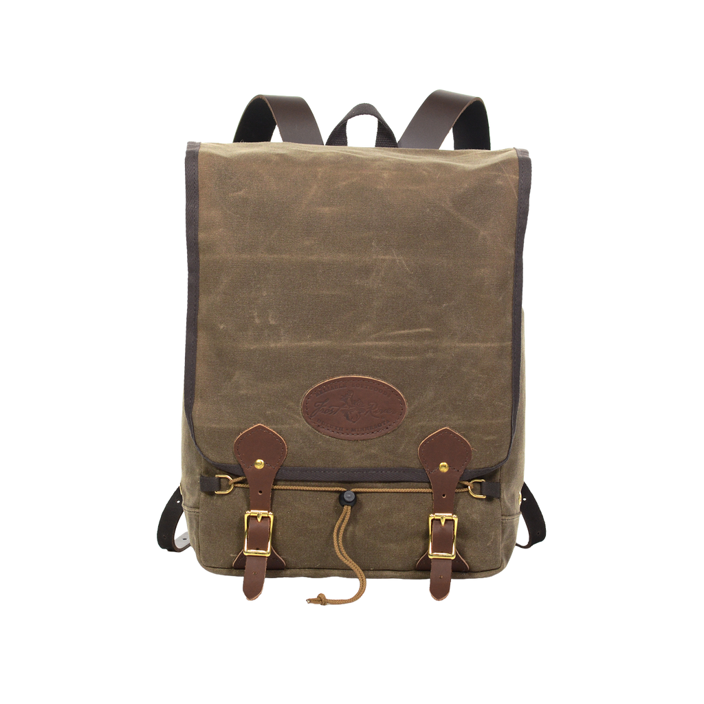 Waxed canvas backpack made with durable materials with a secure large flap closure.