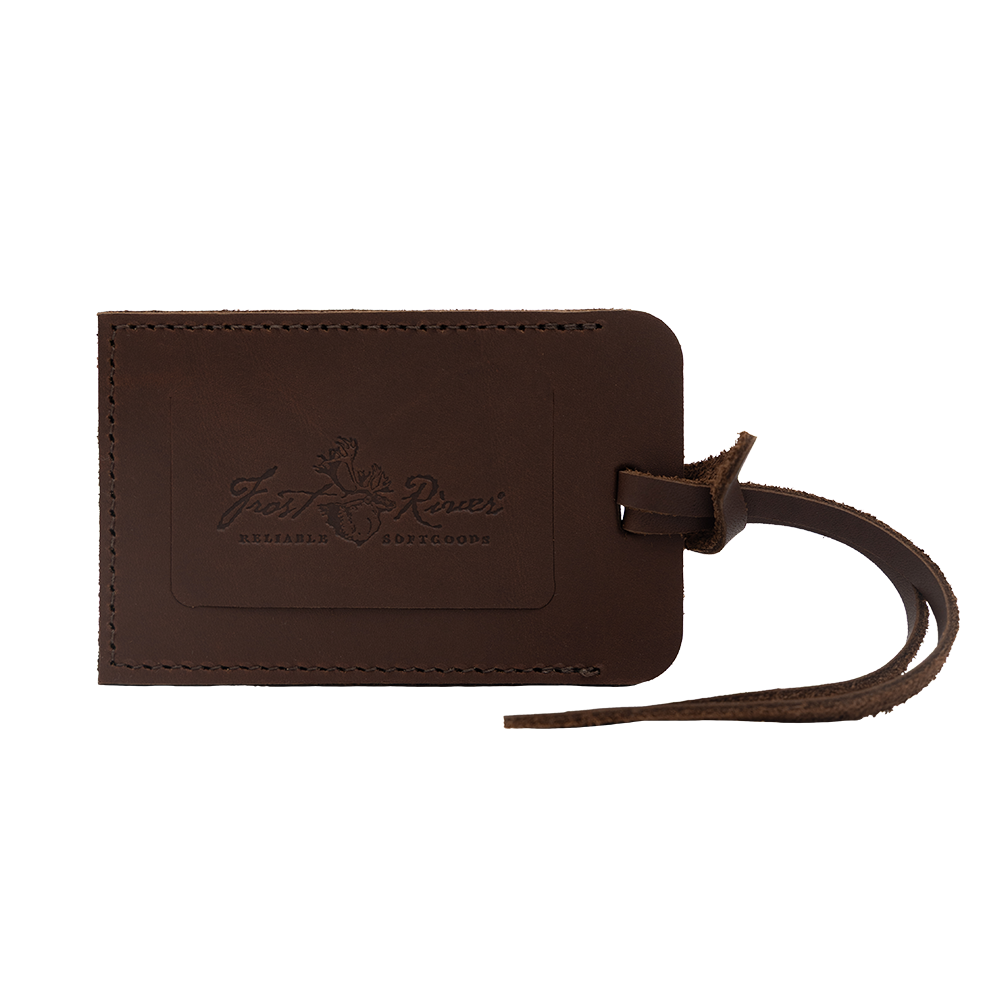 Brown leather luggage tag with a Frost River logo hotstamp