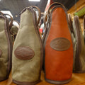 2 Bottle Totes sit side by side on a shelf in a store. 