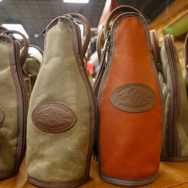 2 Bottle Totes sit side by side on a shelf in a store. 