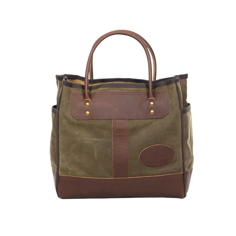 Handcrafted tote with premium rolled leather handles.