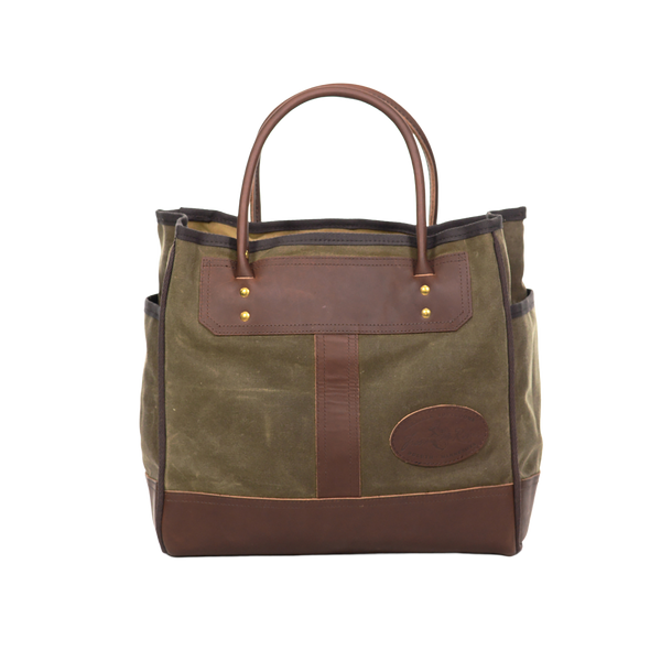 Handcrafted tote with premium rolled leather handles.