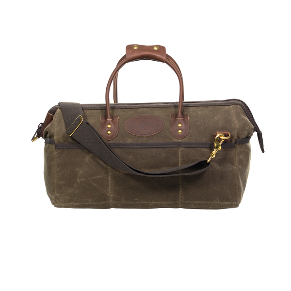 Handcrafted tool bag with a cross body shoulder strap system.