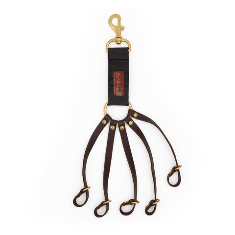A 5 loop game clip handcrafted from cotton web, leather, and solid brass