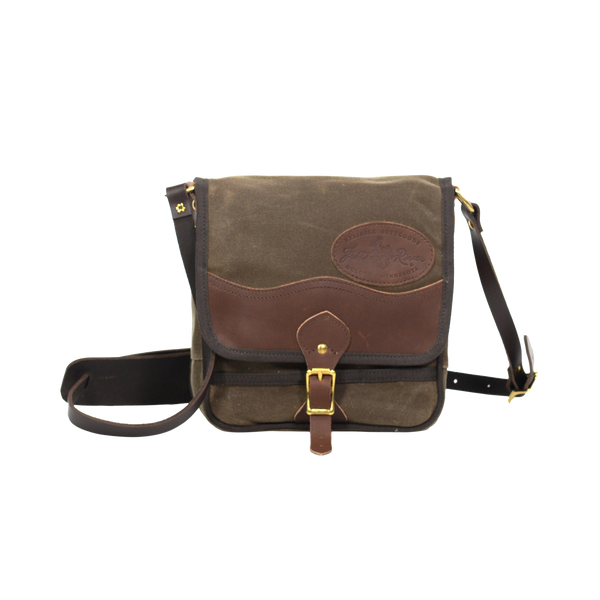Timeless shoulder bag made from waxed canvas, premium leather, and solid brass.