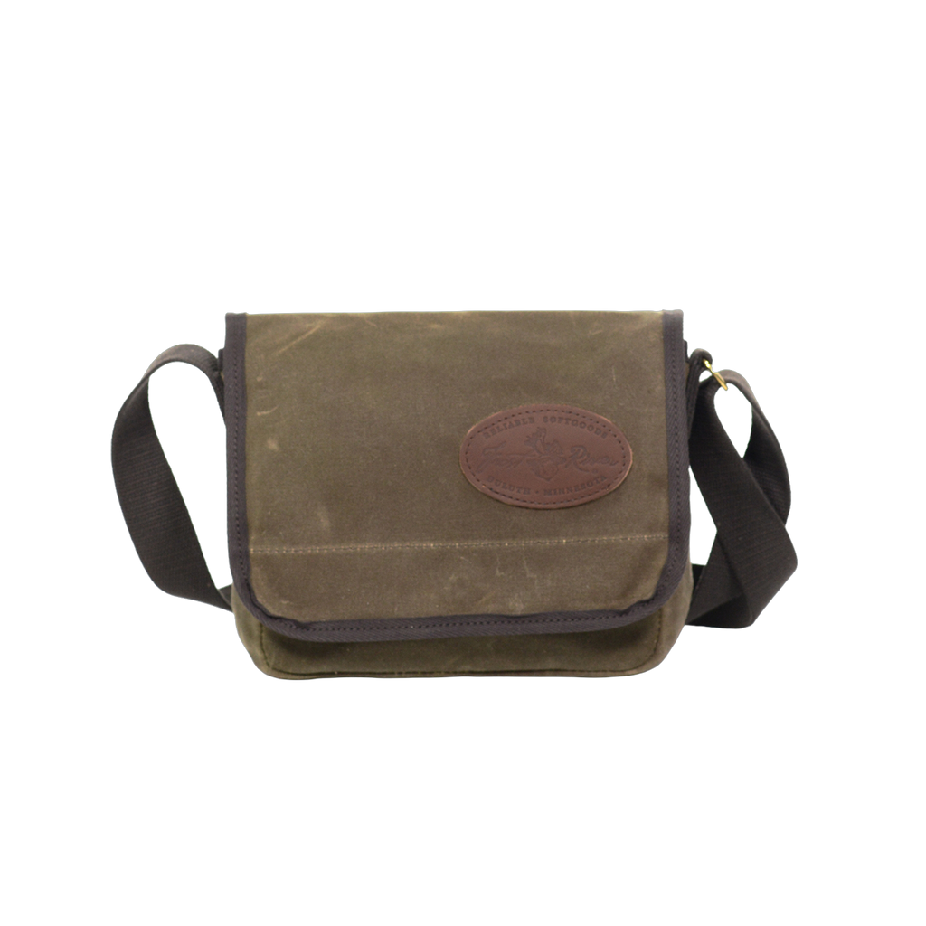 This small to medium sized satchel is handcrafted out of high quality waxed canvas, strong webbed cotton,  solid brass, and premium leather. 