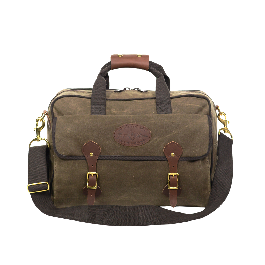 Handcrafted brief bag with heavy duty webbed cotton carrying straps with a leather handle for extra comfort.