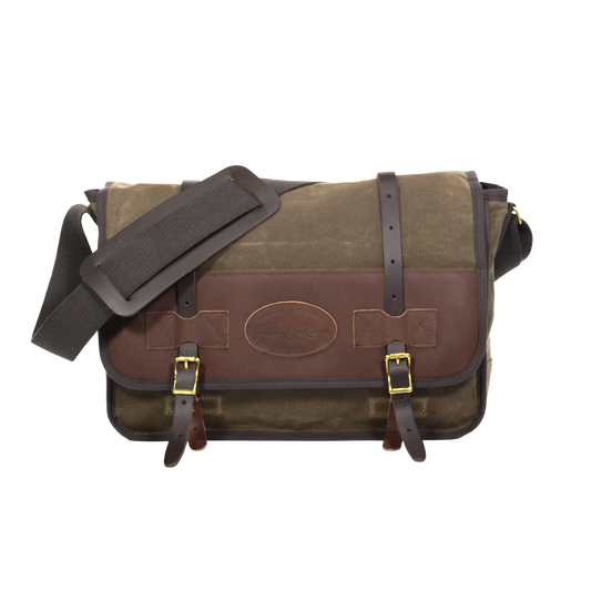 The Vintage Messenger Bag handcrafted out of premium leather, high quality waxed canvas, and sold brass. With two leather straps being secured down by two brass buckles. 