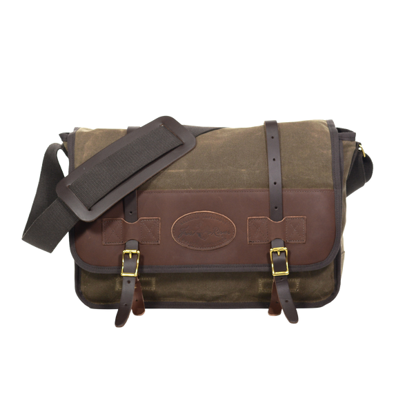 The Vintage Messenger Bag handcrafted out of premium leather, high quality waxed canvas, and sold brass. With two leather straps being secured down by two brass buckles. 