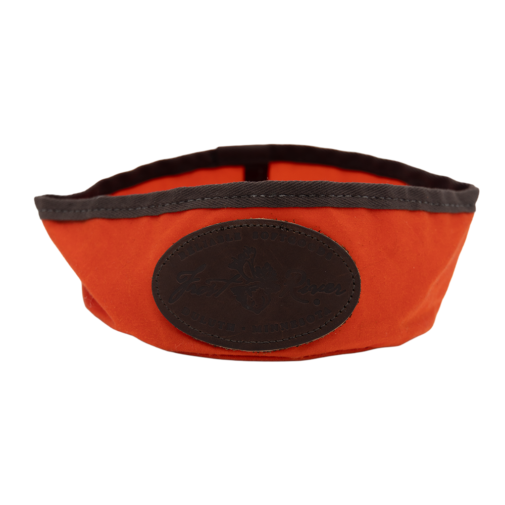 Orange foldable dog dish.
