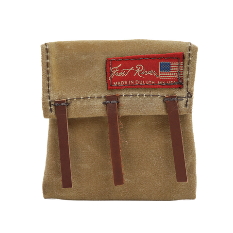 A beige mini canoe pack made of waxed canvas with brown leather straps and a red label that reads 'Frost River', 'Made in USA'.