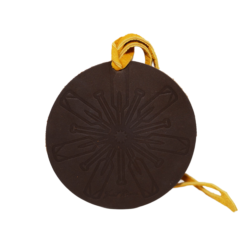 Brown Leather Ornament with snowflake imprint. 