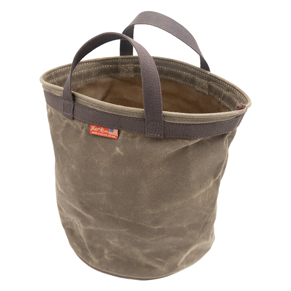 A four gallon waxed canvas bucket for camp or household activities