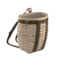 A traditional woven basket with a brown cotton web harness equipped with solid brass hardware.