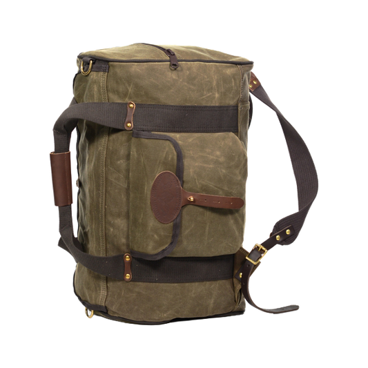 A waxed canvas and leather duffel bag that has back straps attached and a sleeve they tuck into when not in use. 