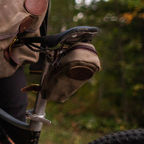 Photo of Fernberg waxed canvas seat bag attached to the bike seat.