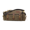 A soft sided tackle box crafted from waxed canvas, leather, and solid brass. 