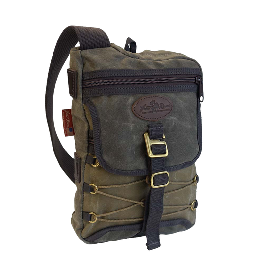 Jay Cooke Sling Pack with a black shoulder strap and brass g-hooks, featuring multiple pockets and a crossbody design.