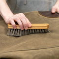 Using the Otter Wax leather and fabric care brush on a Frost River duffel bag. 