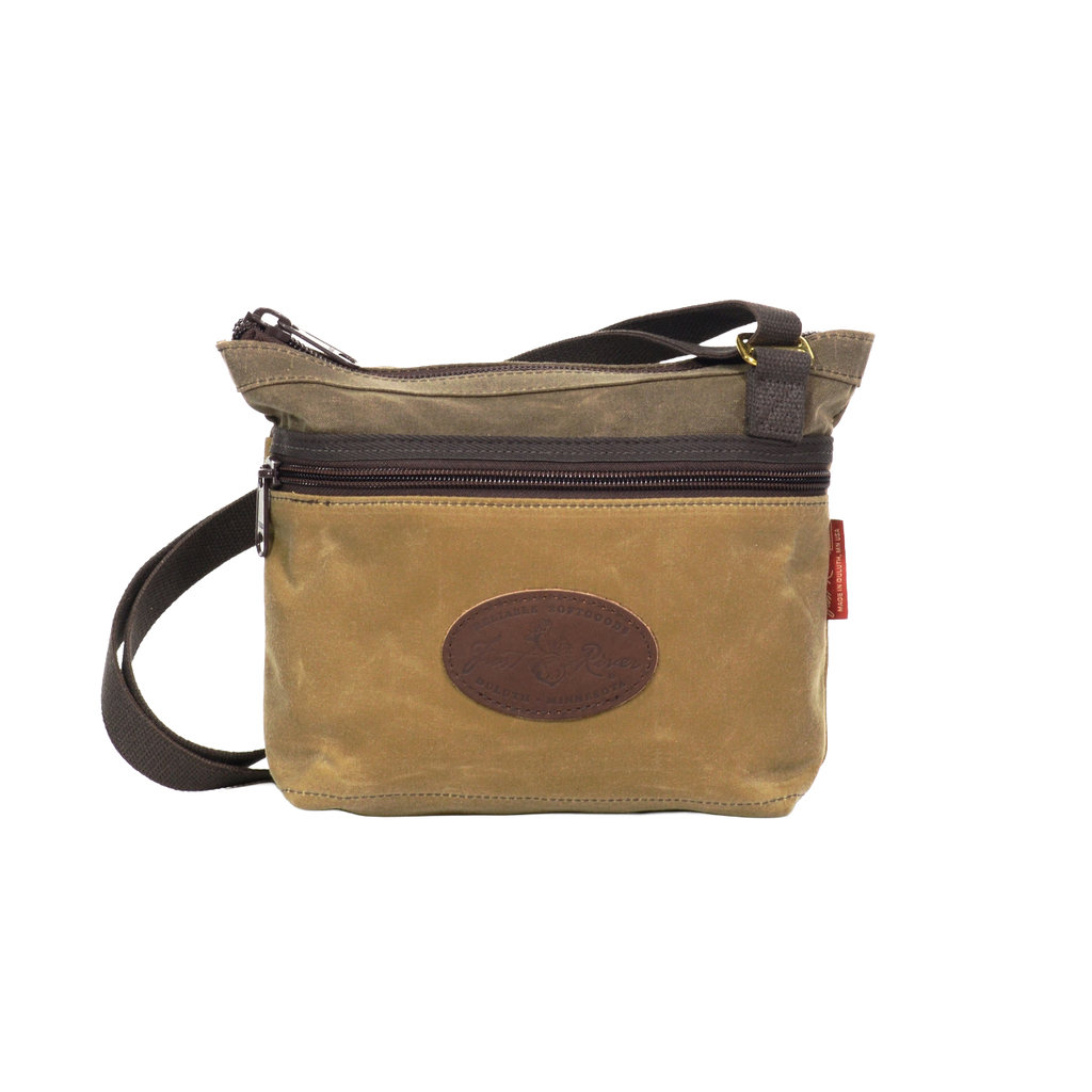 A field tan waxed canvas shoulder bag. 