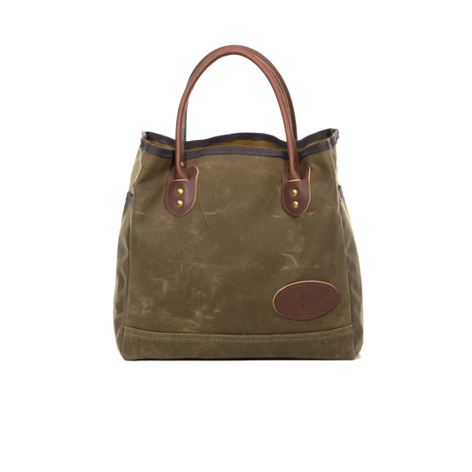 Waxed canvas tote with brown leather handles.