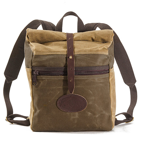 Close up front view of rolldown small backpack with leather strap closure front zipper pocket handcrafted at Frost River.