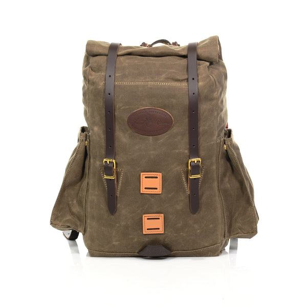 Handcrafted daypack made from premium leather, waxed canvas, and solid brass.