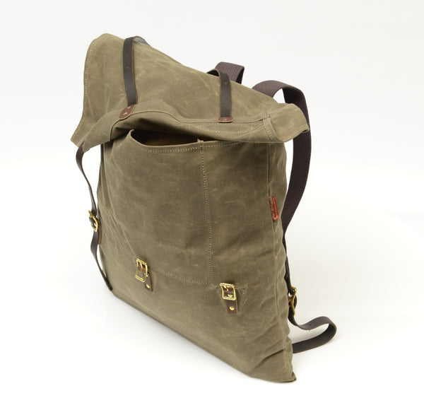The small version of the utility pack have a flap closure with two leather straps that attach to solid brass buckles.