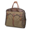 This garment bag has strong leather handles and comes with a shoulder strap for easy carriage.