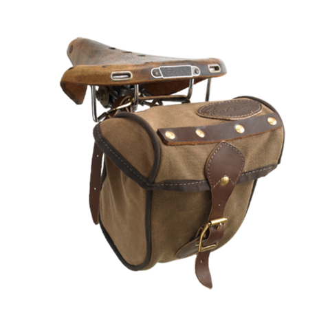 The Eco Trail Seat Bag is crafted out our high quality waxed canvas, high grade premium leather, and durable solid brass. A leather strap with a brass buckle keeps this bag shut.