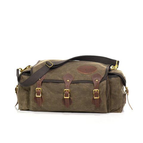 The Frost River Tackle Box is a soft sided tackle box made from durable waxed canvas and full grain leather.