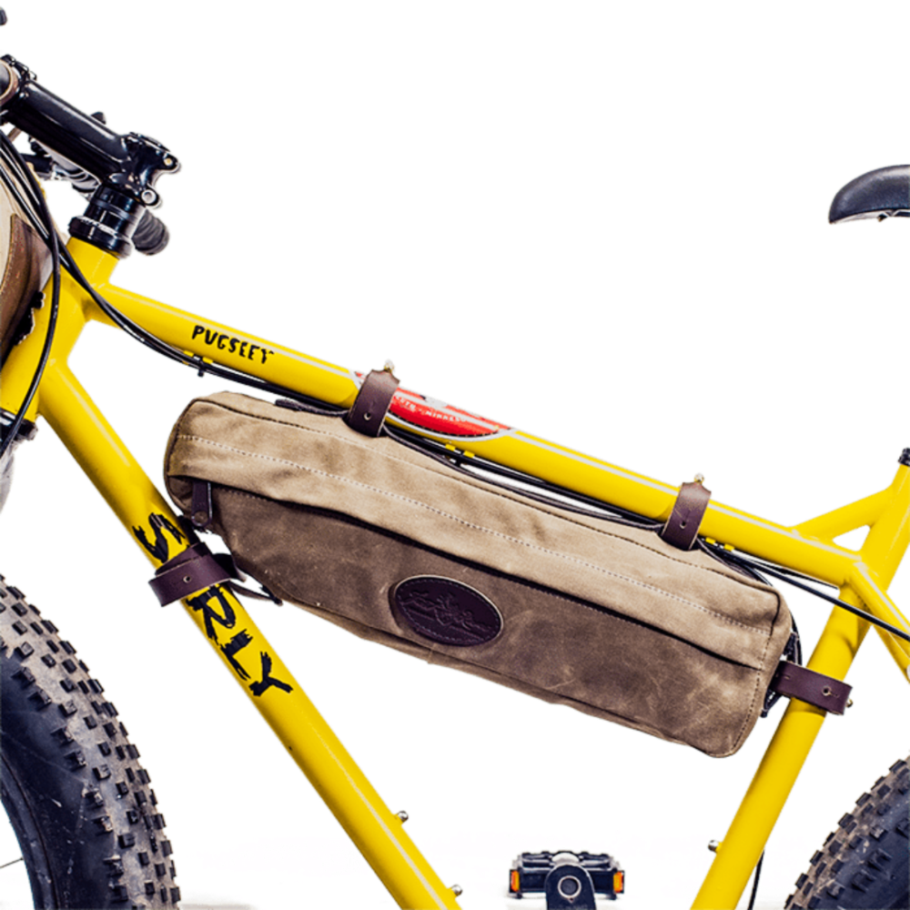 This bike bag connects to the inside of the bike frame with four adjustable leather straps connected to solid brass posts.