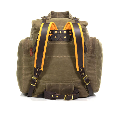 The pack includes premium padded buckskin shoulder straps and a webbed cotton waist belt.